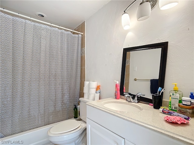 full bathroom with shower / bath combo, vanity, and toilet