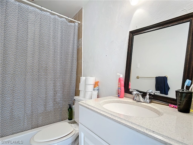 bathroom with walk in shower, vanity, and toilet