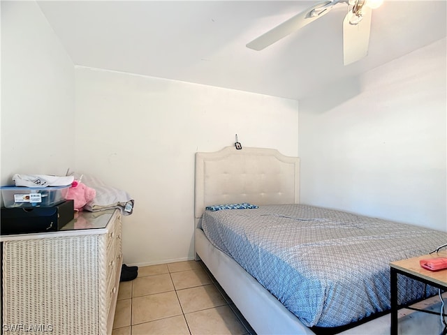 bedroom with light tile patterned floors and ceiling fan