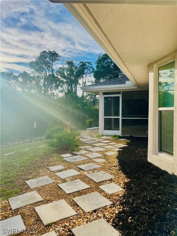 view of yard with a sunroom