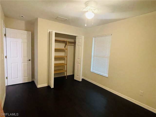 unfurnished bedroom with a closet and ceiling fan