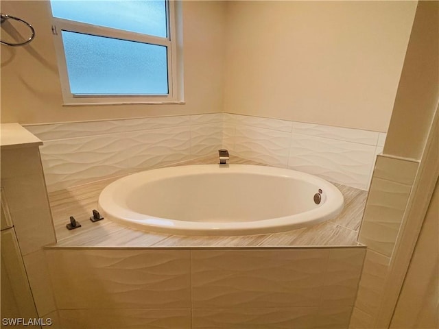 bathroom featuring tiled tub