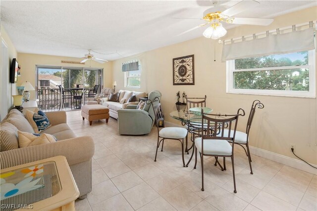 living room with light tile patterned floors and ceiling fan