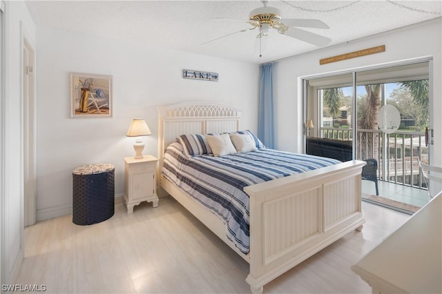 bedroom with light hardwood / wood-style flooring, access to outside, and ceiling fan