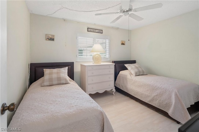 bedroom featuring hardwood / wood-style floors and ceiling fan