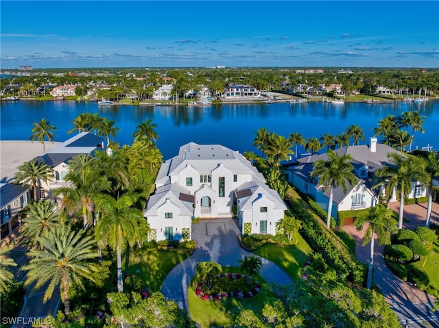 birds eye view of property with a water view