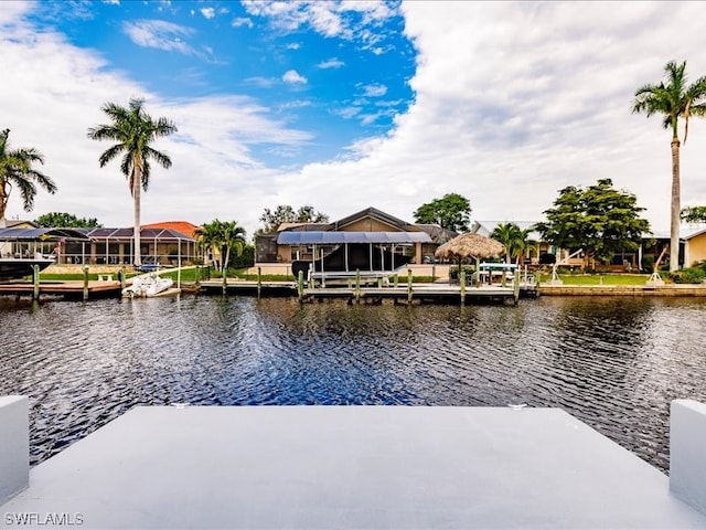 view of dock with a water view and a lanai