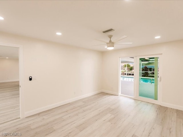 unfurnished room with ceiling fan and light wood-type flooring