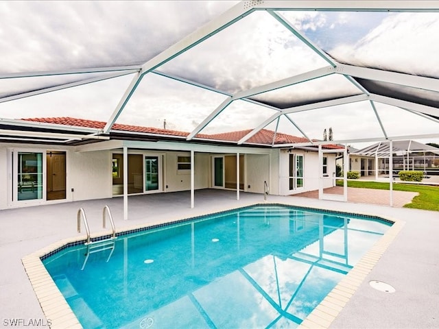 view of pool featuring a patio and a lanai