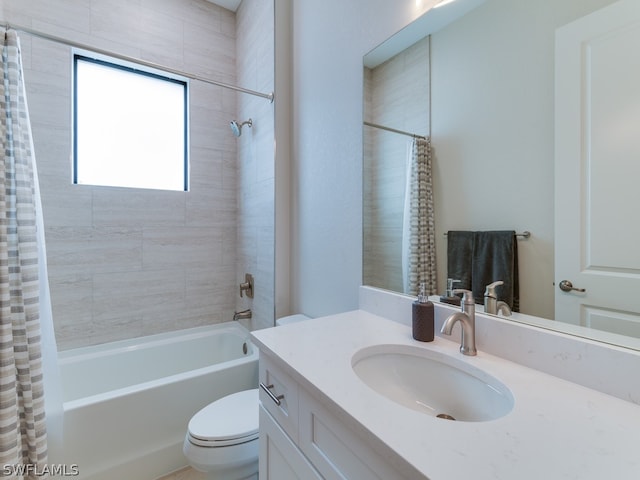 full bathroom with vanity, shower / bath combo with shower curtain, and toilet