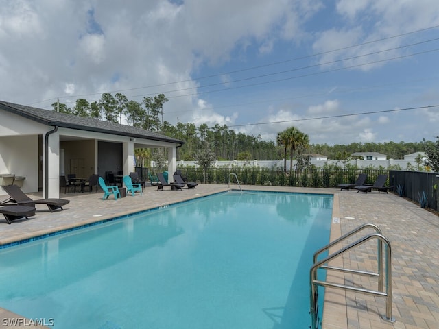 view of pool featuring a patio