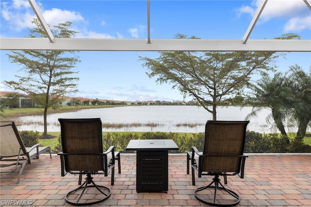 view of patio featuring a water view