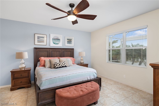 tiled bedroom featuring ceiling fan