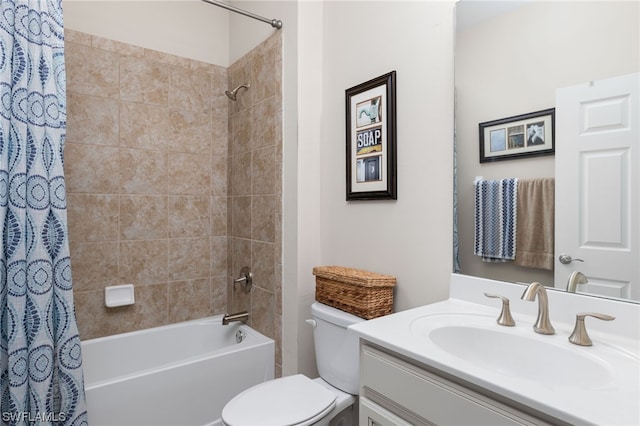 full bathroom featuring toilet, shower / tub combo with curtain, and oversized vanity