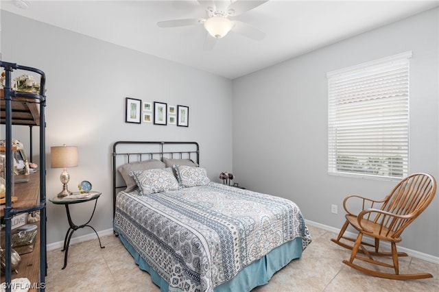 tiled bedroom featuring ceiling fan