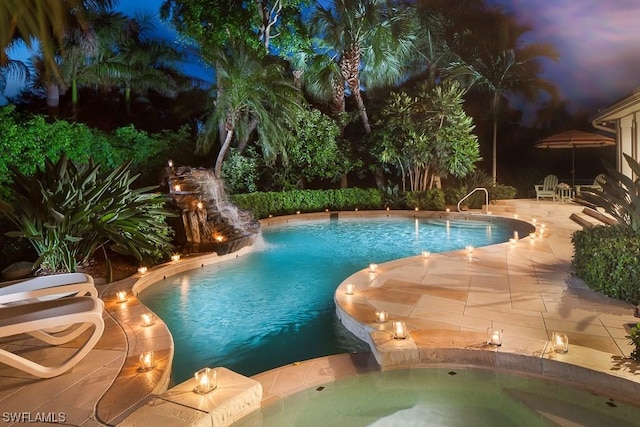 view of pool featuring a patio and an in ground hot tub