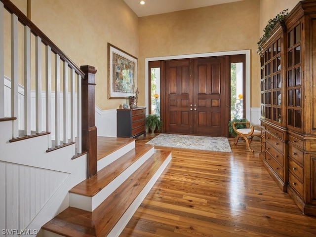 entrance foyer with a wealth of natural light and wood-type flooring