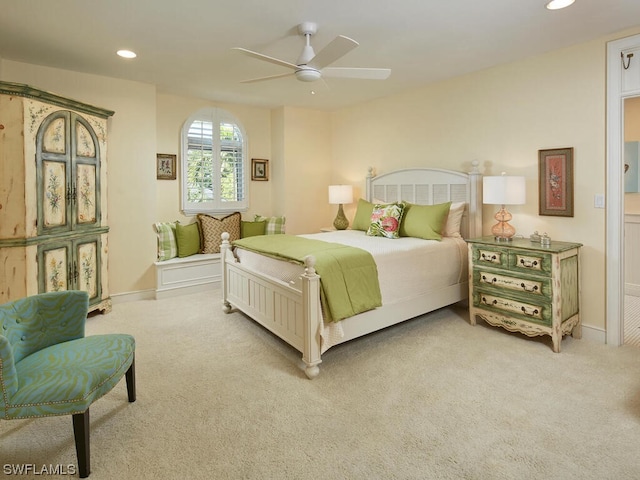 bedroom with light colored carpet and ceiling fan