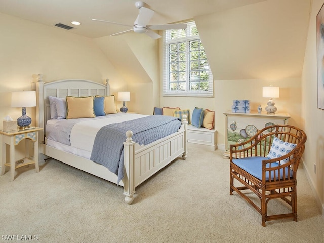 carpeted bedroom with vaulted ceiling