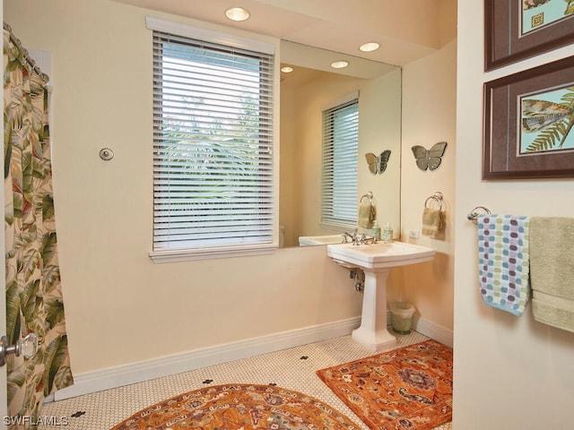 bathroom with tile patterned floors