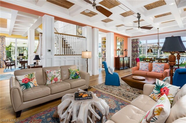 living room with ceiling fan, hardwood / wood-style floors, coffered ceiling, and beamed ceiling