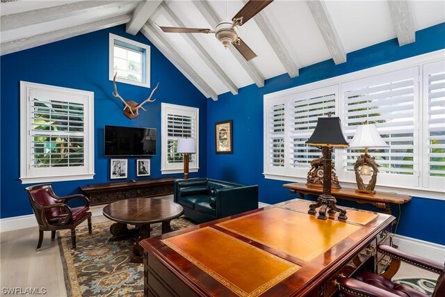 office space with vaulted ceiling with beams, hardwood / wood-style floors, and ceiling fan