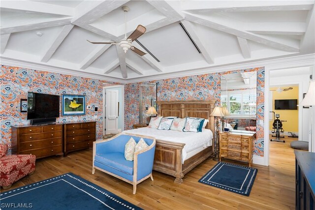 bedroom with beam ceiling, ceiling fan, and hardwood / wood-style flooring