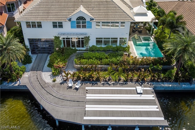 rear view of property featuring a water view