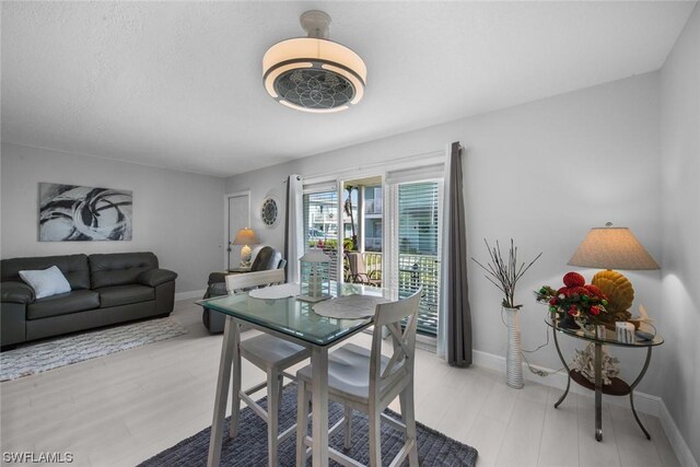 dining room with light hardwood / wood-style floors