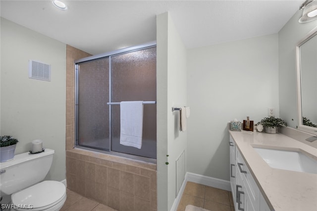 bathroom with tile patterned flooring, toilet, and vanity