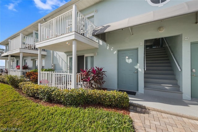 entrance to property with a balcony