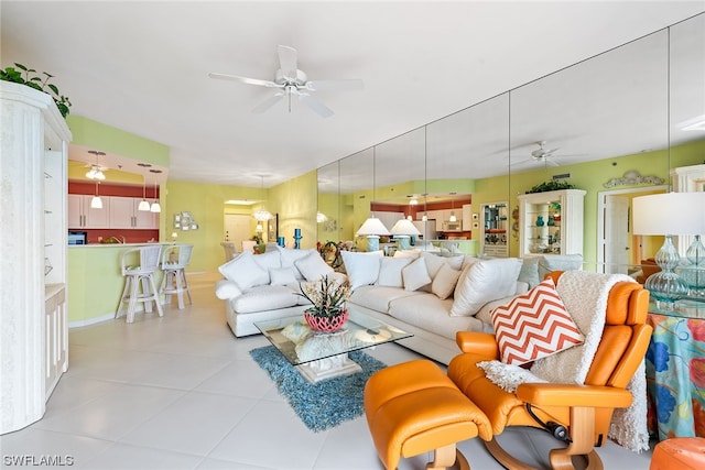 living room with light tile patterned floors and ceiling fan