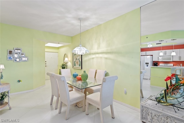 dining room with light tile patterned flooring