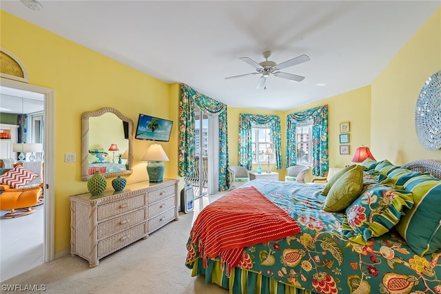 carpeted bedroom with ceiling fan and access to exterior