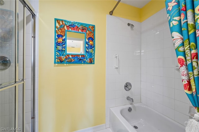 bathroom featuring tiled shower / bath