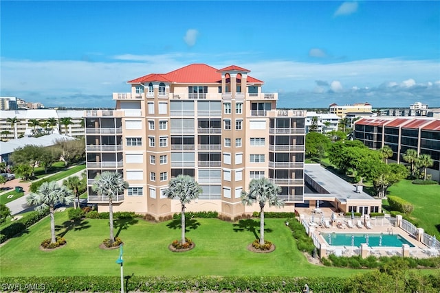 view of building exterior with a community pool