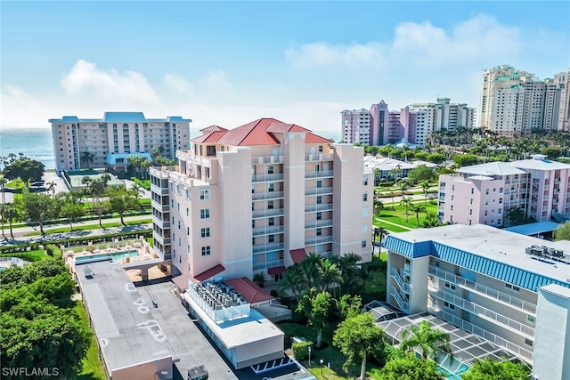 birds eye view of property with a water view