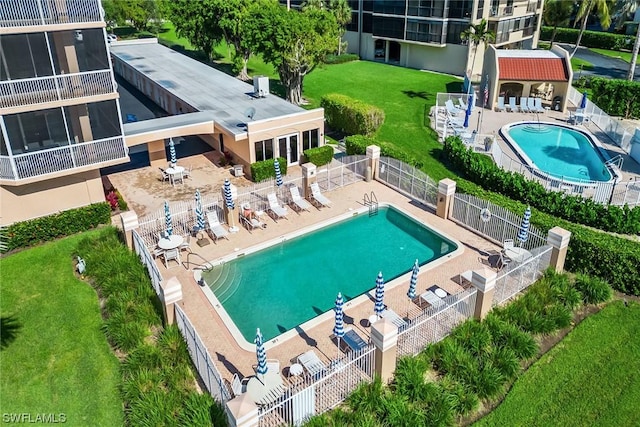 view of swimming pool featuring a patio area