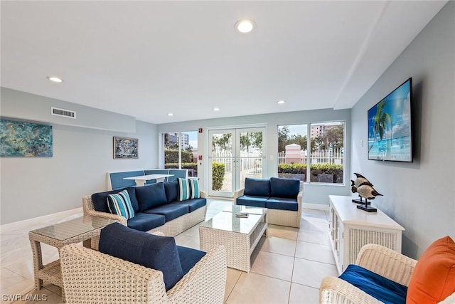 tiled living room featuring french doors