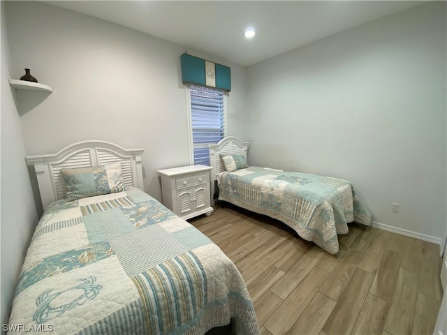 bedroom with light wood-type flooring