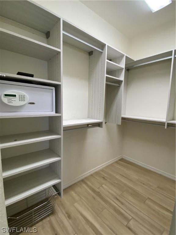 walk in closet featuring light hardwood / wood-style floors