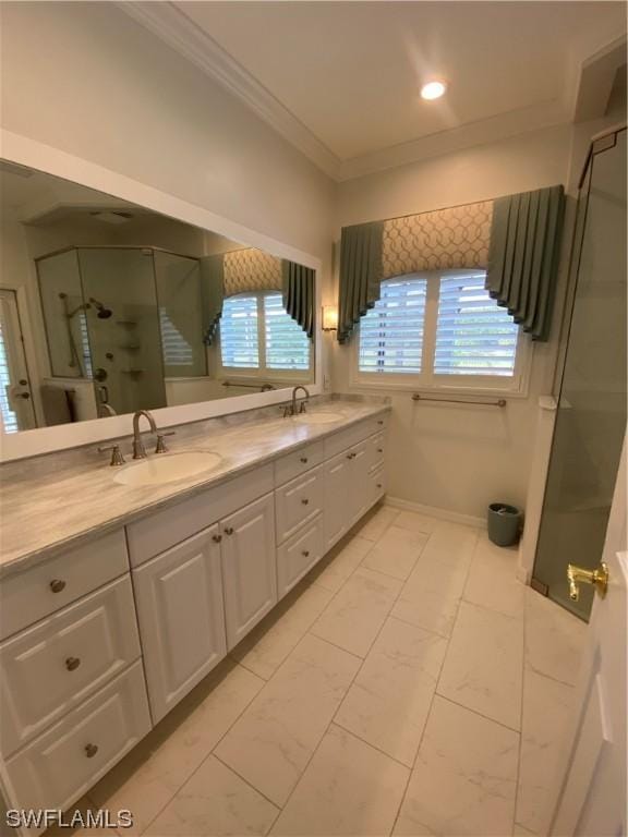 bathroom featuring vanity, ornamental molding, and an enclosed shower