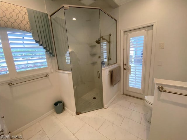 bathroom with toilet and walk in shower