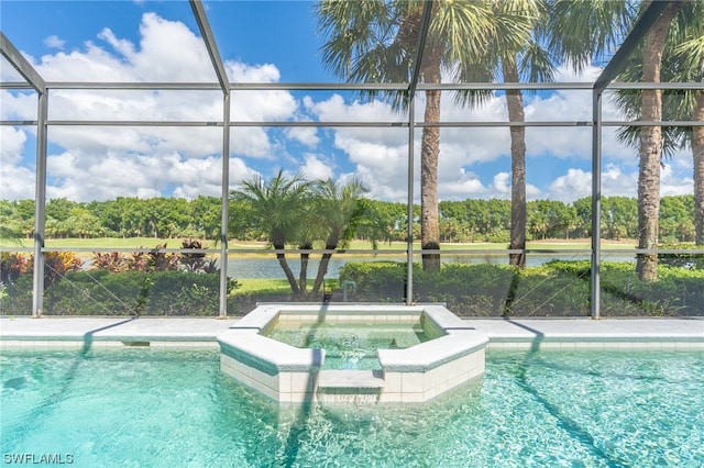 view of swimming pool with glass enclosure, an in ground hot tub, and a water view