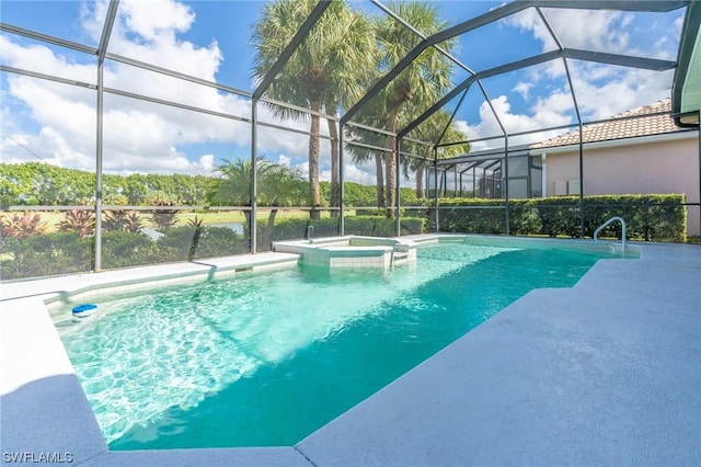 view of pool with an in ground hot tub, a patio, and glass enclosure