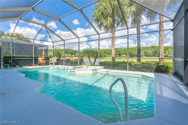 view of pool featuring an in ground hot tub, glass enclosure, and a patio