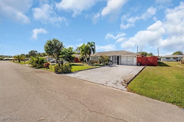 single story home with a garage and a front yard