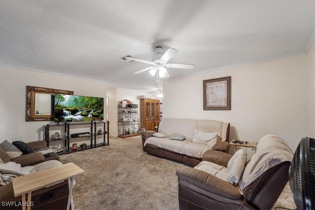 living room featuring carpet flooring, ceiling fan, and crown molding