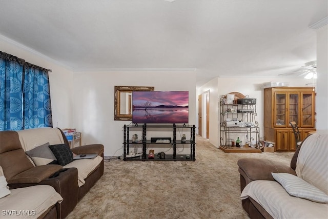 carpeted living room featuring ceiling fan and ornamental molding