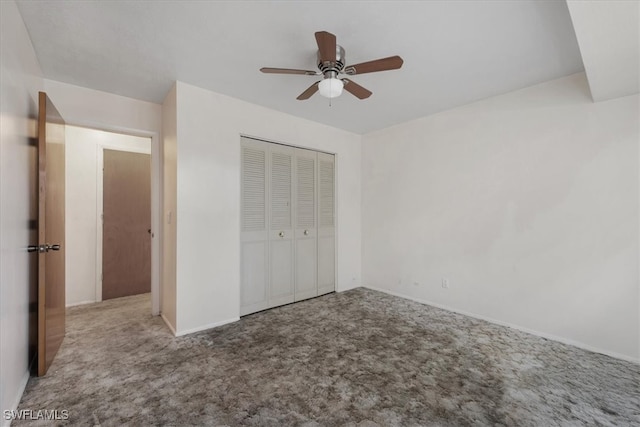 unfurnished bedroom with carpet, ceiling fan, and a closet